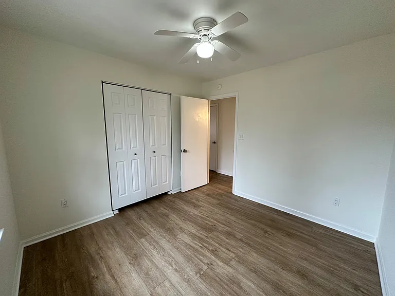 Bedroom #4 with a large closet and view of the front yard, This is the first bedroom as you walk down the hallway.