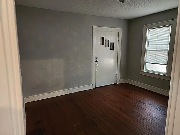 Bedroom with exterior entrance door