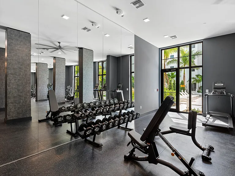 Strength training equipment and free weights support a variety of fitness goals and workout styles.