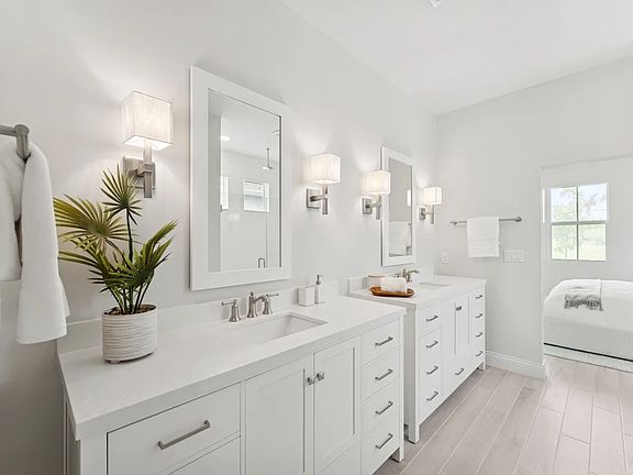 Primary bath with dual freestanding vanities