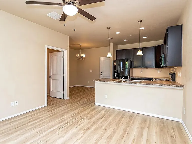 Living room area, kitchen and formal dining room area
