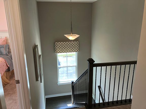 well lit staircase with railings