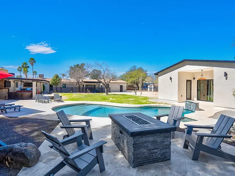 Gas fireplace, pool, grass play area, casita.
