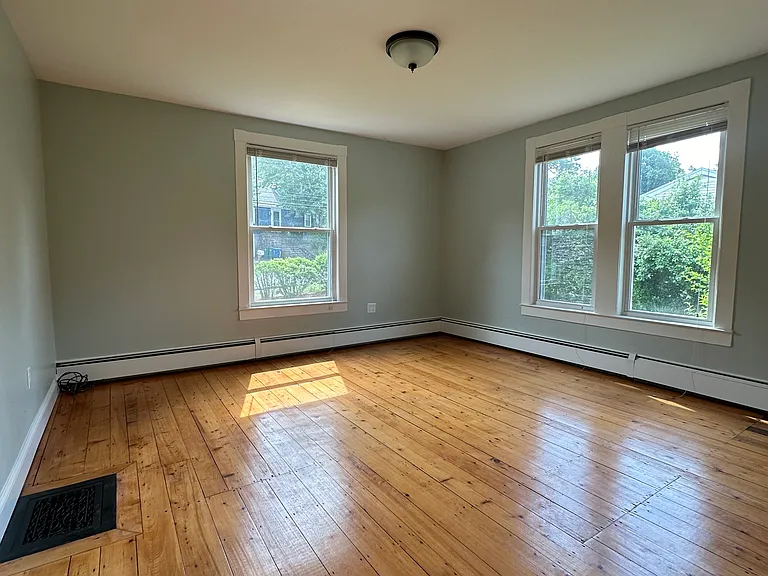 Generous primary bedroom with dedicated closet and ample natural light