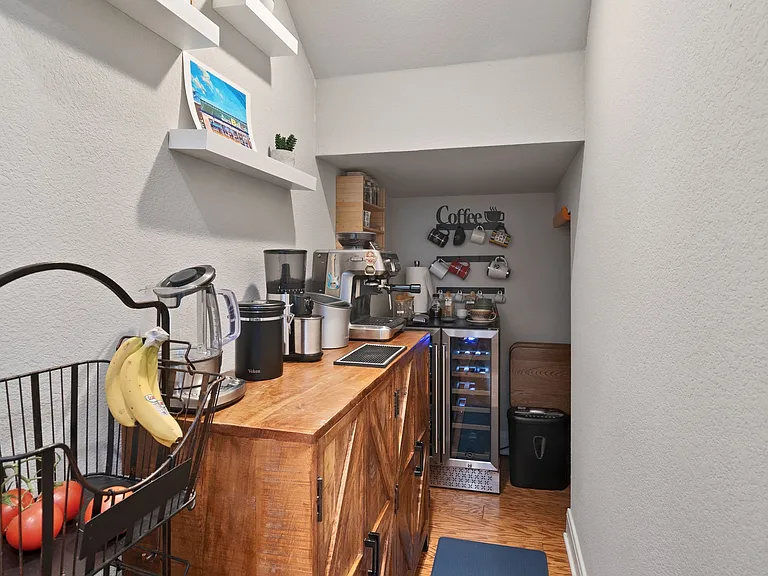 Under stairs storage used as a coffee bar area