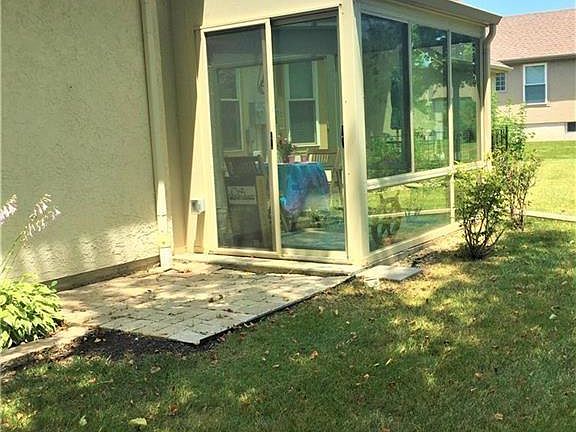 Sliding doors to yard from sunroom.