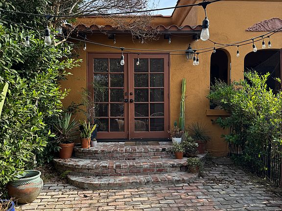 Private front yard. French doors open to front sun room.