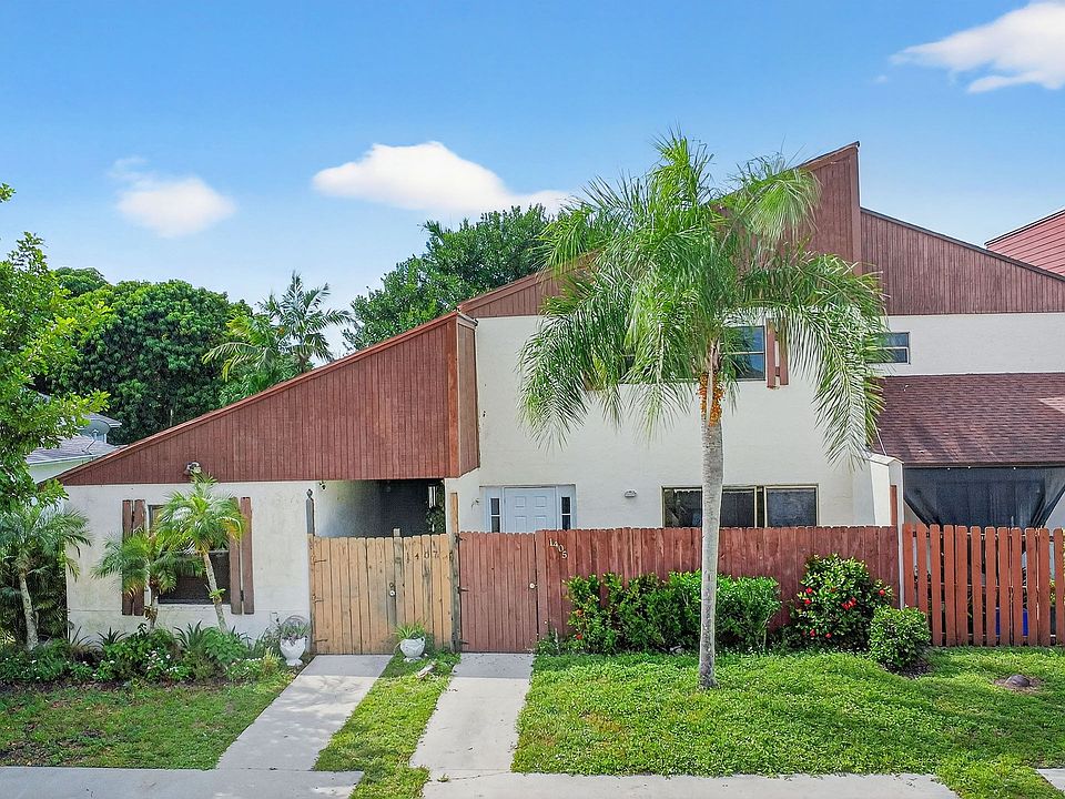 Front of Unit with the tall tree in front