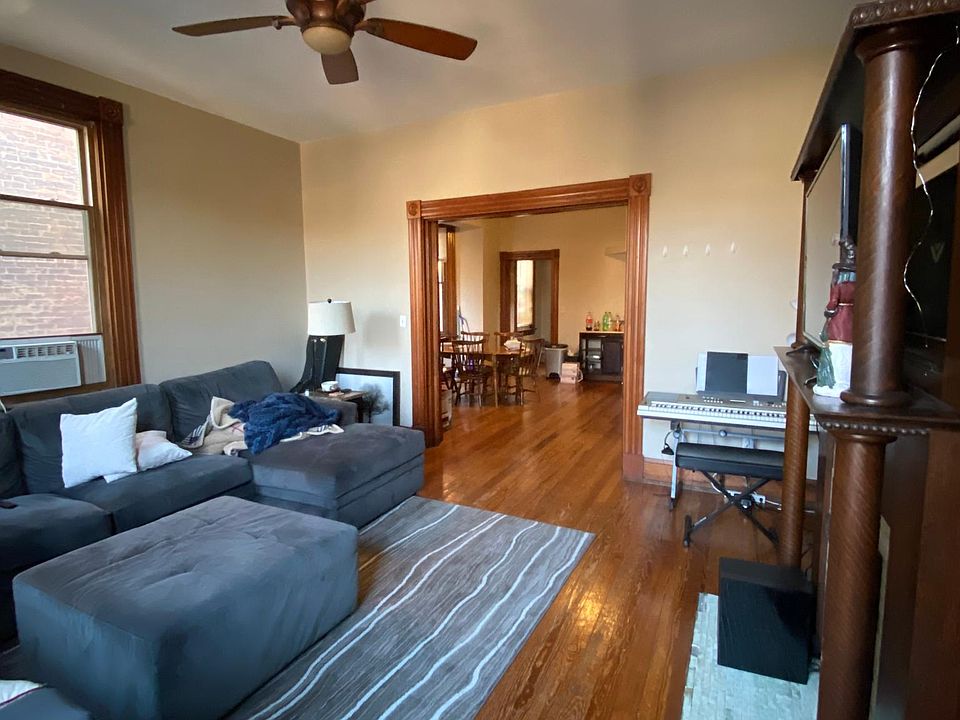 Standing in the living room, looking towards the kitchen.