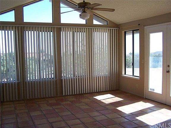 Large Bonus Room off of den with views and access to fenced backyard.