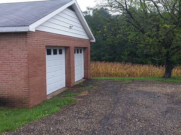 Two-Door Detached Garage with Remotes and Workbench