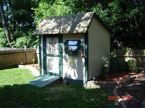 Backyard- Cedar Storage Shed with Stone Outline Garden Planters