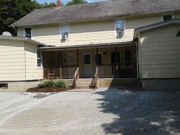 Rear entrance, parking, left 1st floor apartment, porch