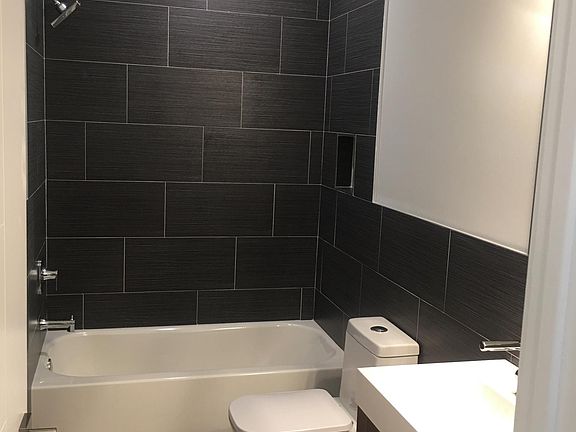Sleek full bathroom with great storage in the vanity to keep all of your belongings neat and tidy.