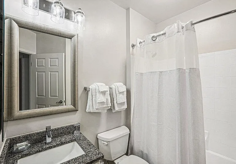 Apartment Bathroom Featuring Single Vanity and Overhead Lighting