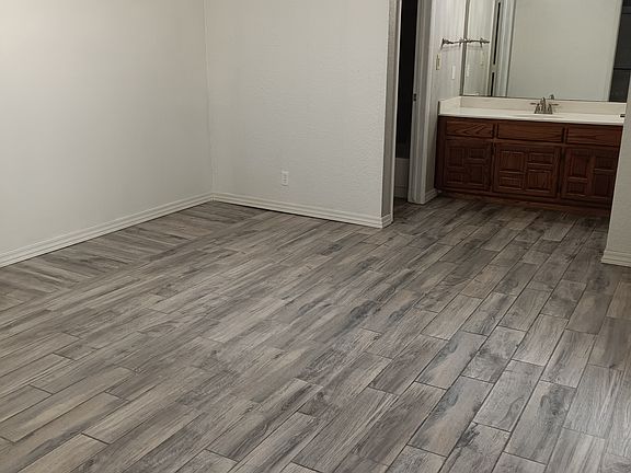 Master bedroom, room for king bed and 2 nightstands and dresser. Patio access. En suite bathroom. 3 closets. Main closet is walk-in.