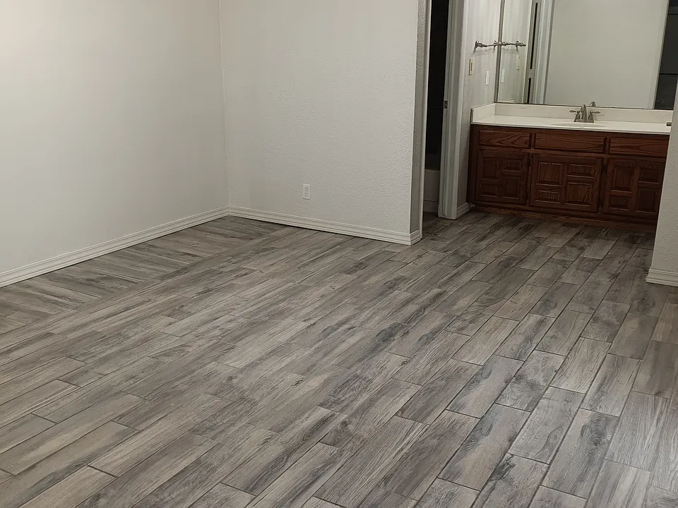 Master bedroom, room for king bed and 2 nightstands and dresser. Patio access. En suite bathroom. 3 closets. Main closet is walk-in.