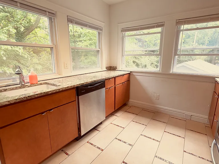 Kitchen with Stainless Steel Appliances and Modern Light Fixture