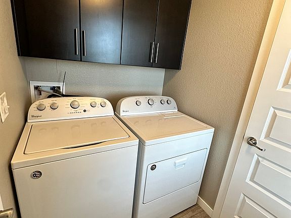 Washer/dryer included in the laundry room. It is on the same level as the front door and connects to the utility room