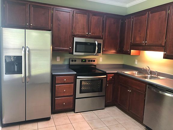 Large kitchen with stainless appliances.