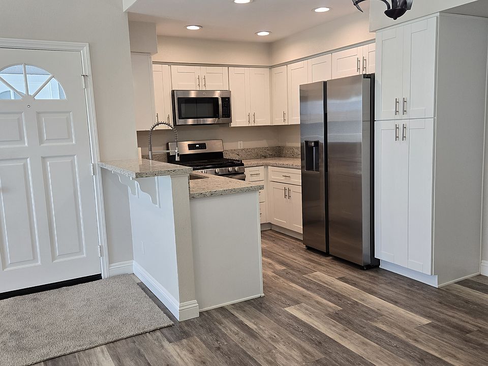 Top floor condo with cathedral ceilings. LVP floors in kitchen and dining room and carpet elsewhere.