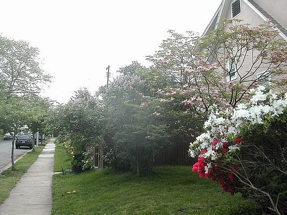 side view with fenced backyard
