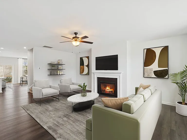 Upgrade Package Living room with hard-surface vinyl plank flooring throughout and fireplace