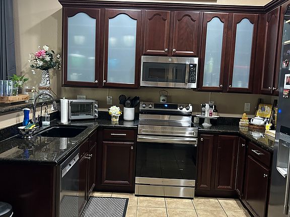 Kitchen with granite counter and all appliances