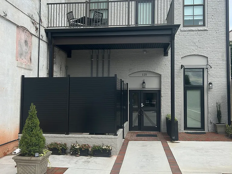 Apartment One is the lower right door. Private rear green space area. Secure private courtyard with 24 / 7 security cameras.