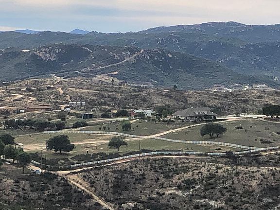 1 hour from Lindberg Field Airport. Smaller sage-colored house in the middle of the photo.