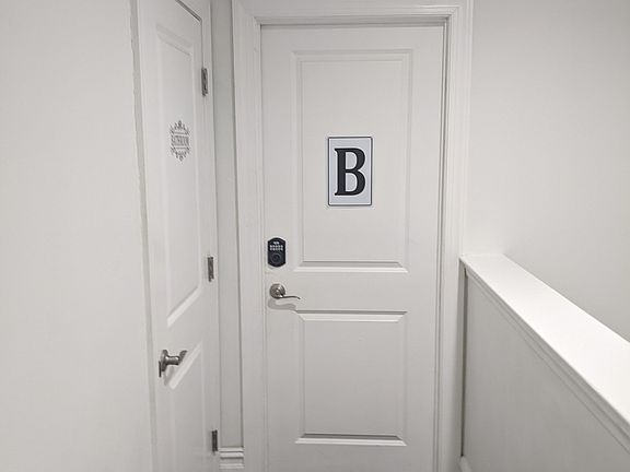 Bedroom door & private bathroom next to the room