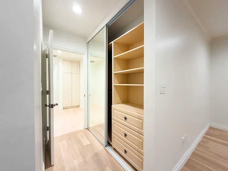 Open closet reveals custom shelving and drawers, showcasing smart storage in this Beverly Hills luxury rental at 1094 Garden Lane, a 90210 lease.