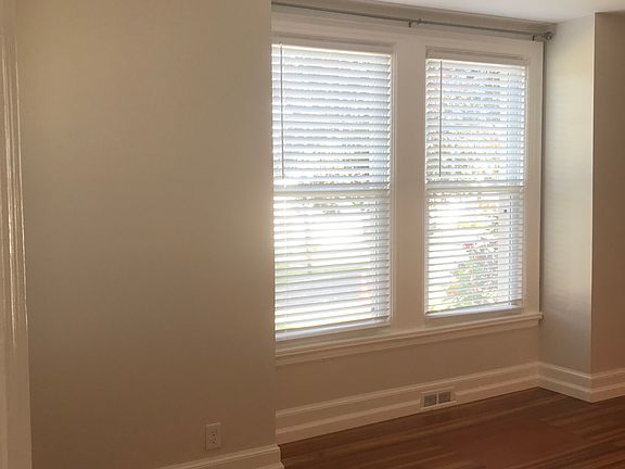 Living room windows 
Upgraded blinds & curtain rods installed throughout townhouse