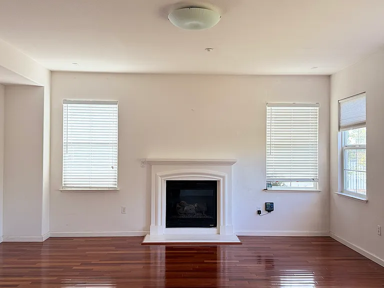 Family room with fireplace and natural light