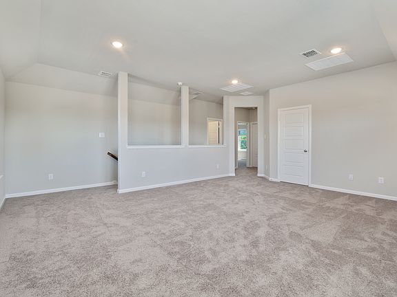 Game room in the Masters home plan by Trophy Signature Homes - REPRESENTATIVE PHOTO