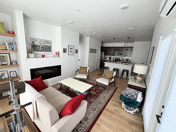 View living room to kitchen. Note: there is a dining nook, 4-top table to be added. Dining at bar also.