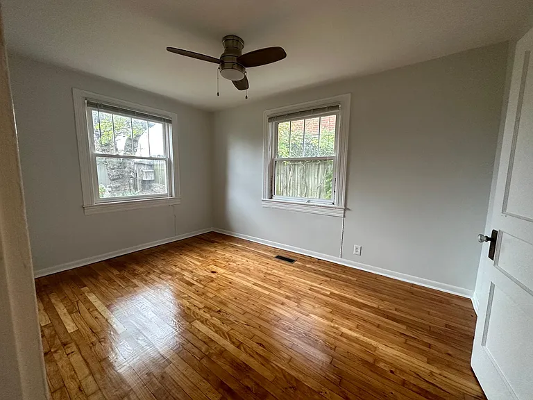 Great size bedroom with ceiling fan and washer and dryer in the closet.