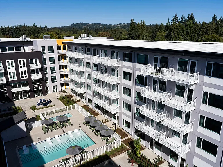 Enjoy a resort-style pool, lush landscaped courtyard, and inviting grilling stations perfect for outdoor living.
