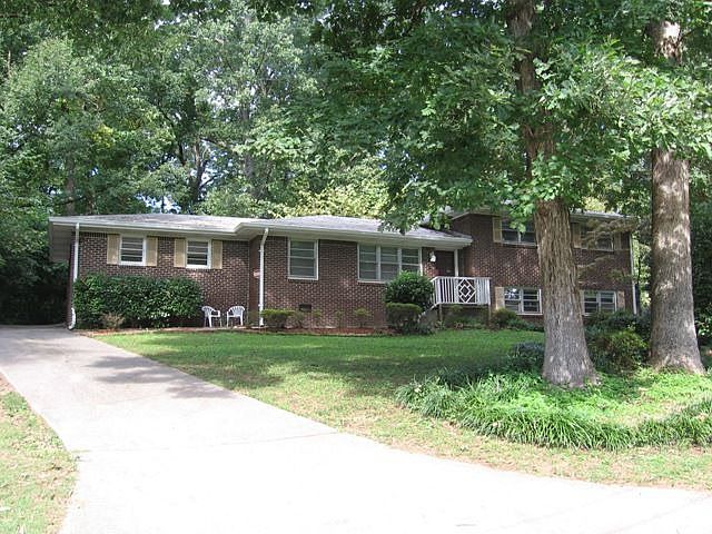 All brick on tree-shaded lot
