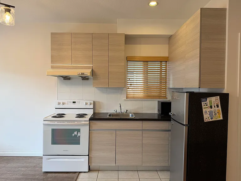 6952 Curtis St — Photo 12