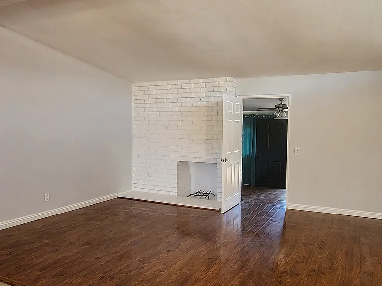 Living Room, high ceiling. Door to bonus room