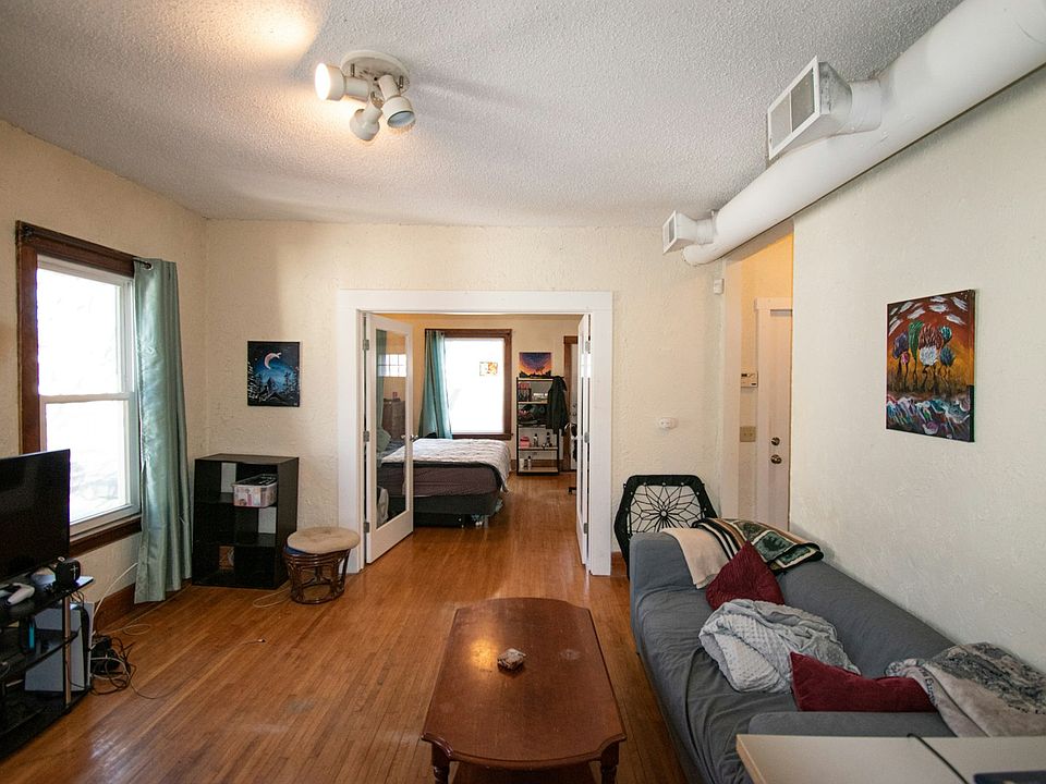 Living room into bedroom with double door entry