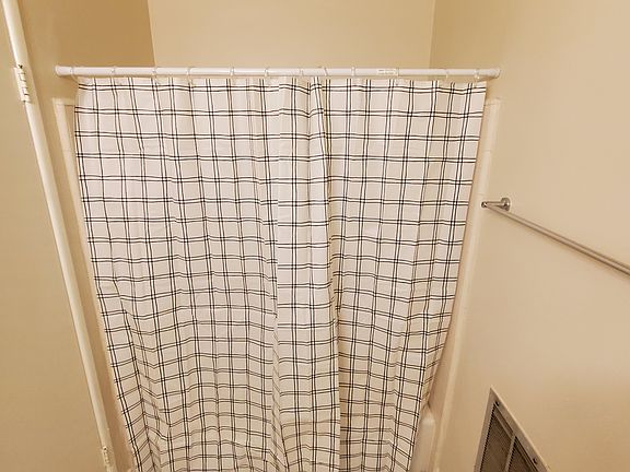 Bathtub with shower curtain