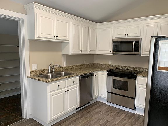 Newly renovated kitchen with stainless appliances, granite, dishwasher, Dispose-All, smooth cooktop, side-by-side refrigerator/freezer. All new plumbing and wiring. New crawlspace vents to improve utilities. New HVAC.