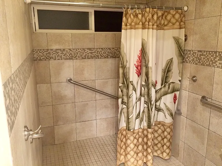 Large master bathroom shower and wheelchair accessible too.