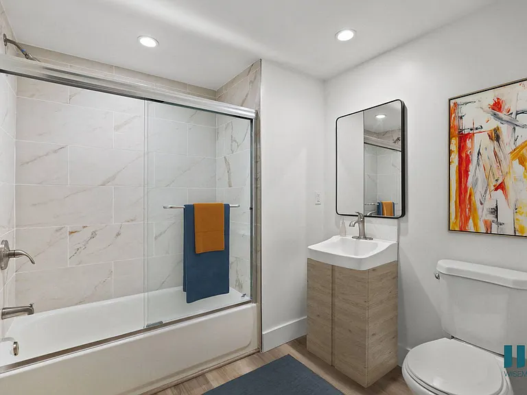 Bathroom with Shower Bath with Glass Door and vanity Cabinet Storage