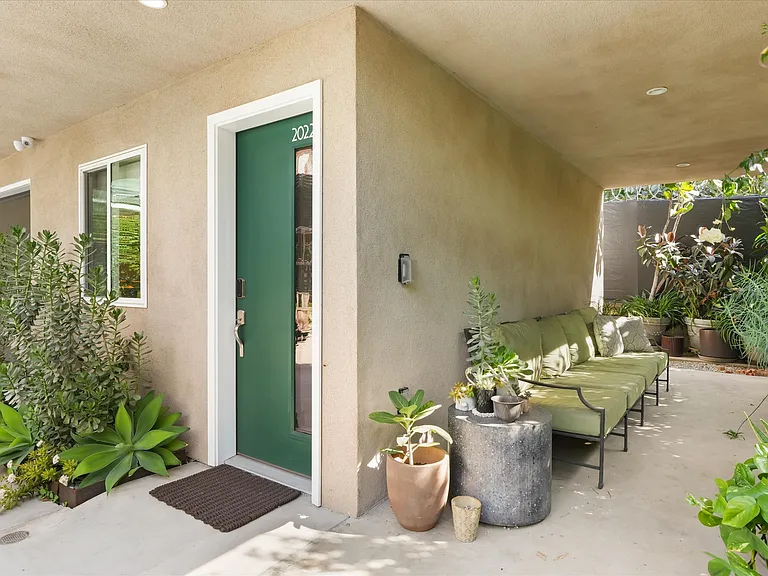 Exterior view of detached residence with private entry.