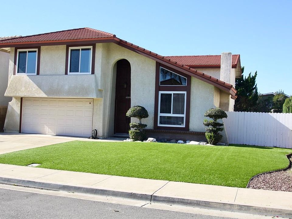 Front of house, with artificial grass.