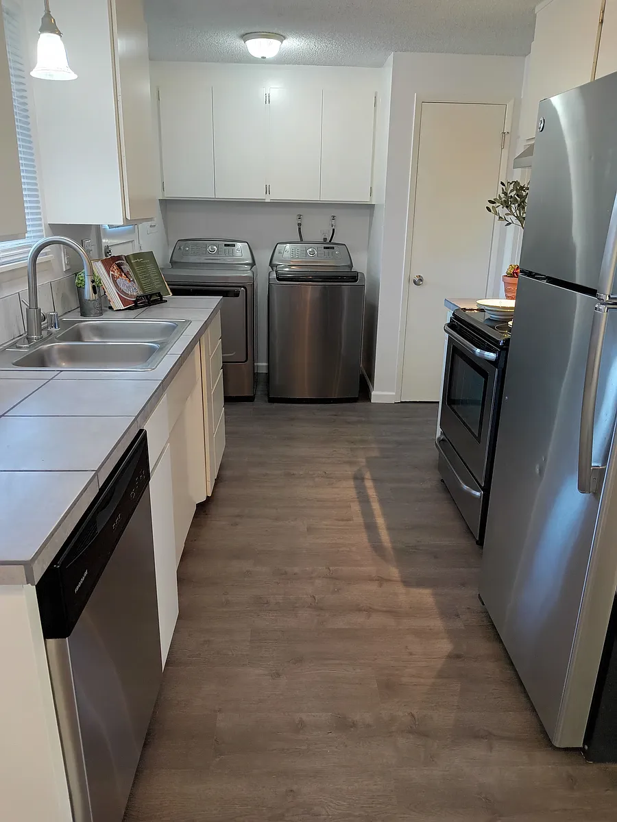 Efficient galley kitchen with stainless steel appliances and Kenmore Elite washer and dryer - 501 21st St SE #A