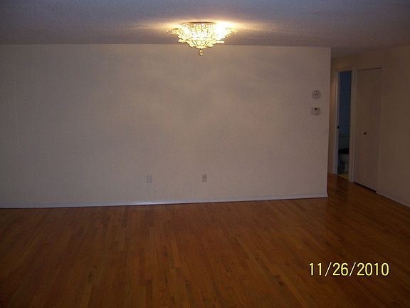 living room with crystal chandelier